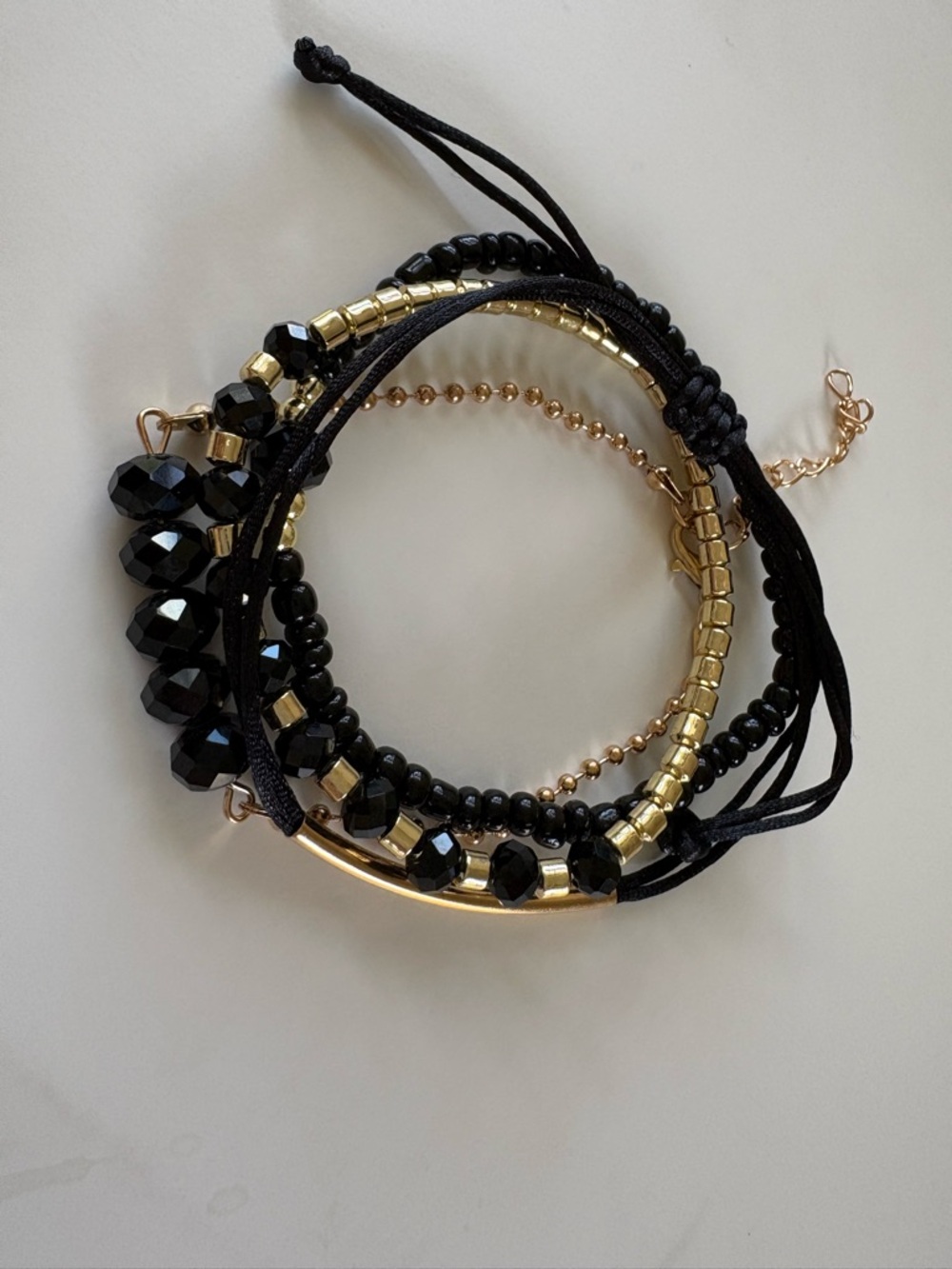 Gold & Black Multi-Strand Beaded Bracelet (4 Strands) – Elegant Layered Style